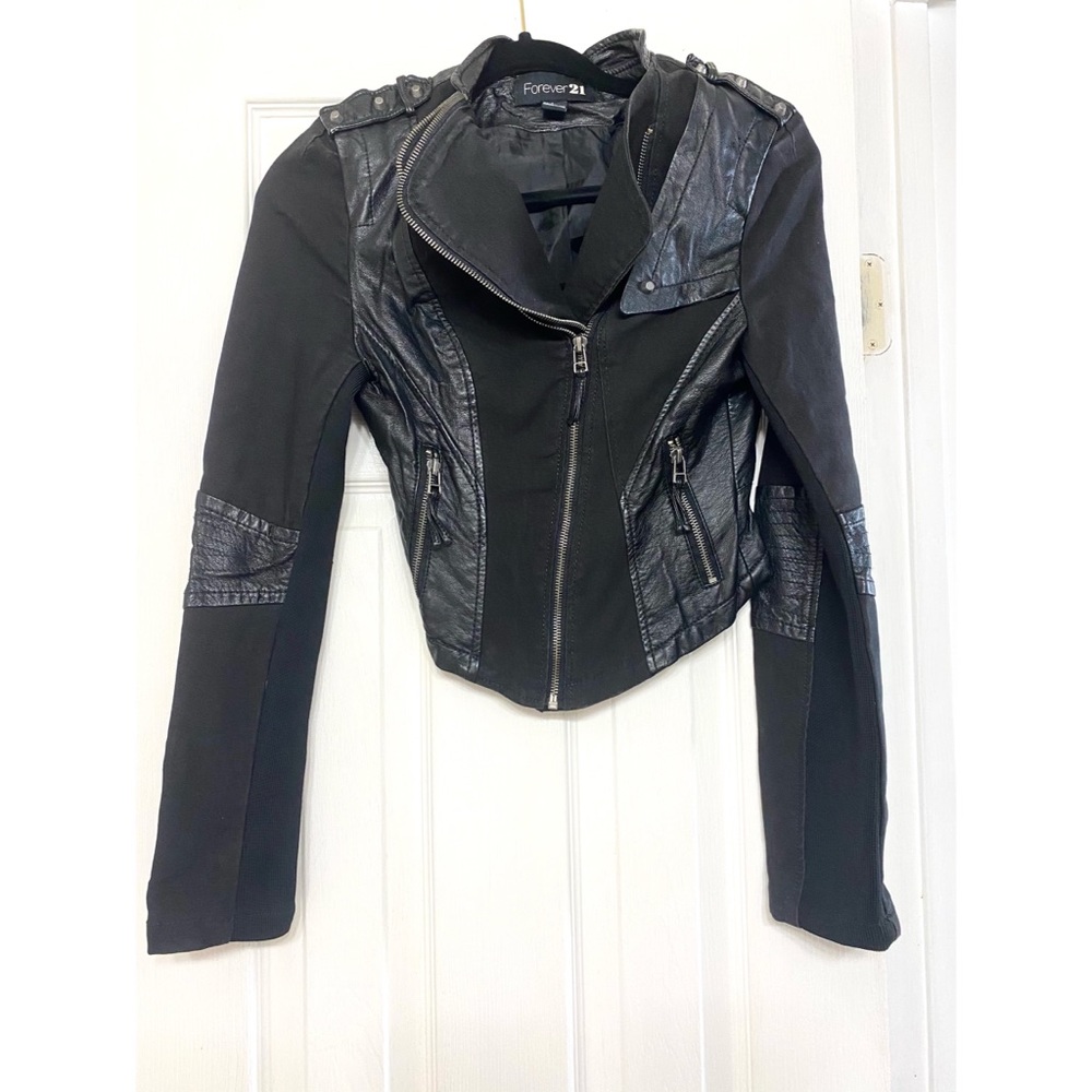 Black zip up jacket with a lot of detail
